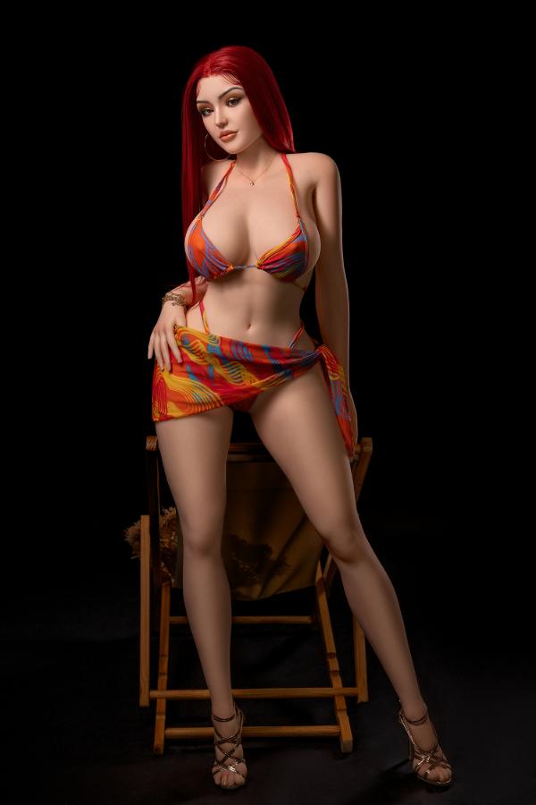 Scarlett 169cm curvy D-cup fat butt hybrid sex doll standing in a colourful bikini top and sarong by a deck chair