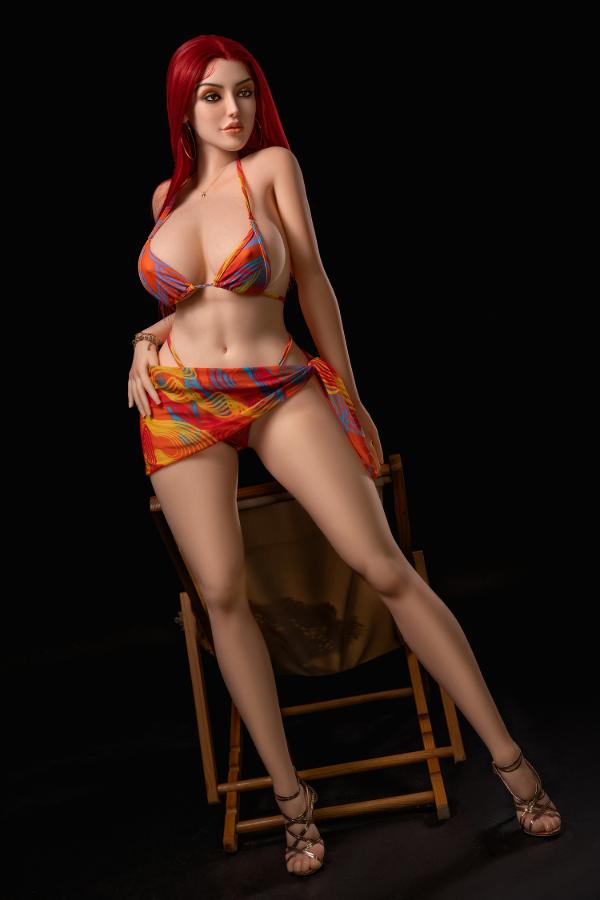 Scarlett curvy D-cup hybrid sex doll posing in a bikini top and colourful sarong
